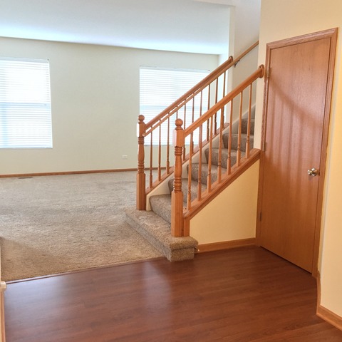 562 Wynbrooke Road Romeoville, IL 60446 - Photo 6 of 24 a view of an empty room with stairs
