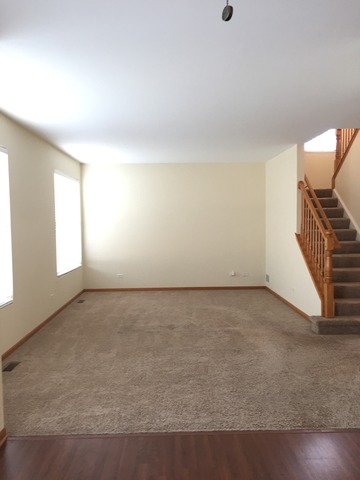 562 Wynbrooke Road Romeoville, IL 60446 - Photo 7 of 24 an empty room with windows