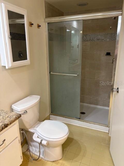 68 Country Club Drive Largo, FL 33771 - Photo 11 of 19 a bathroom with a toilet and a shower
