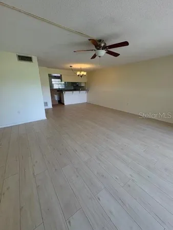 a view of a porch with furniture and yard