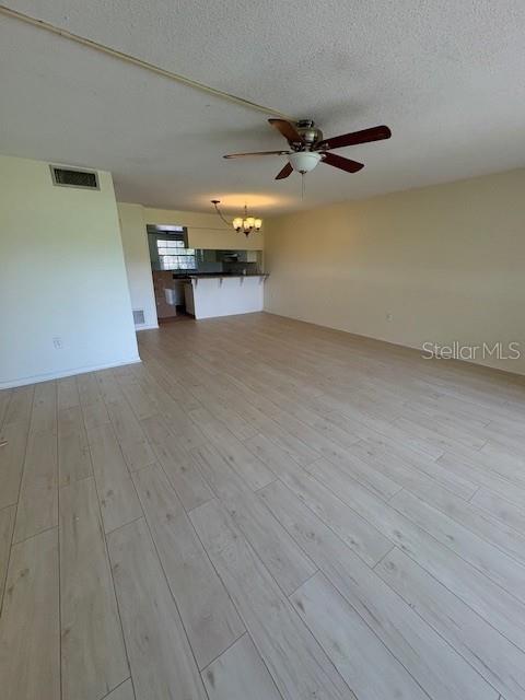 68 Country Club Drive Largo, FL 33771 - Photo 12 of 19 wooden floor in an empty room