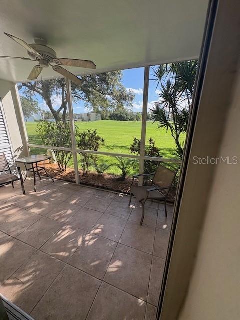 68 Country Club Drive Largo, FL 33771 - Photo 13 of 19 a view of a porch with furniture and yard
