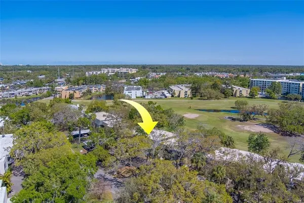 a view of a lake with houses in the back