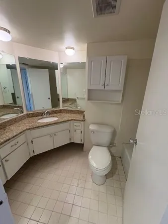 an empty room with a empty space and windows