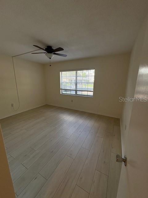 68 Country Club Drive Largo, FL 33771 - Photo 8 of 19 an empty room with a empty space and windows