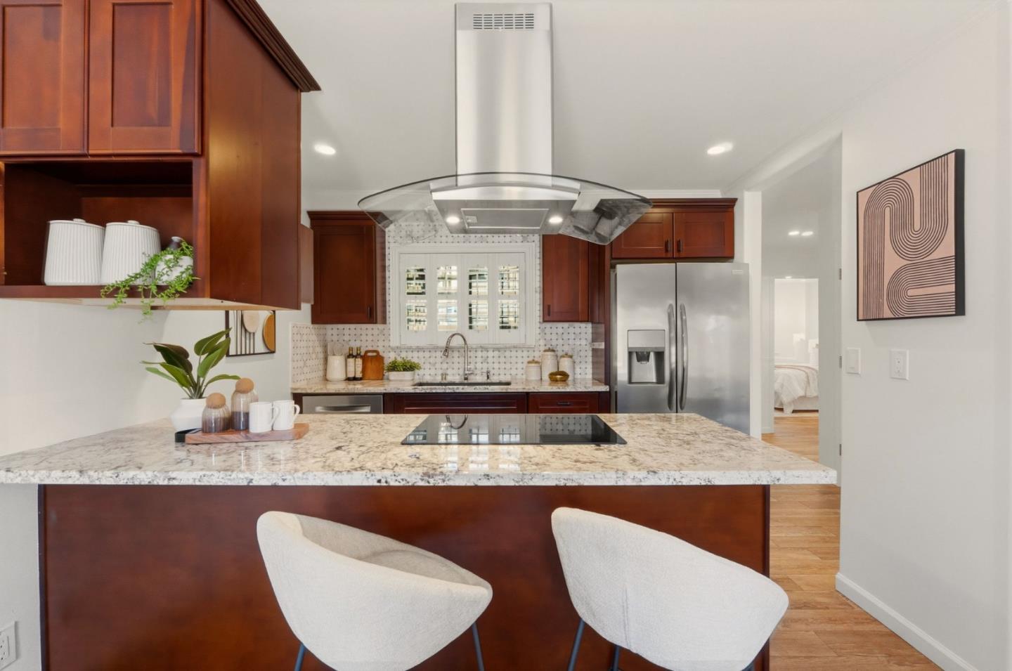 104 East Middlefield Road, Unit B Mountain View, CA 94043 - Photo 12 of 48 a kitchen with granite countertop kitchen island stainless steel appliances a sink stove and cabinets