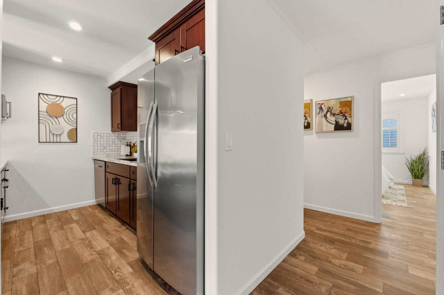 104 East Middlefield Road, Unit B Mountain View, CA 94043 - Photo 17 of 48 a view of a refrigerator in kitchen and wooden floor