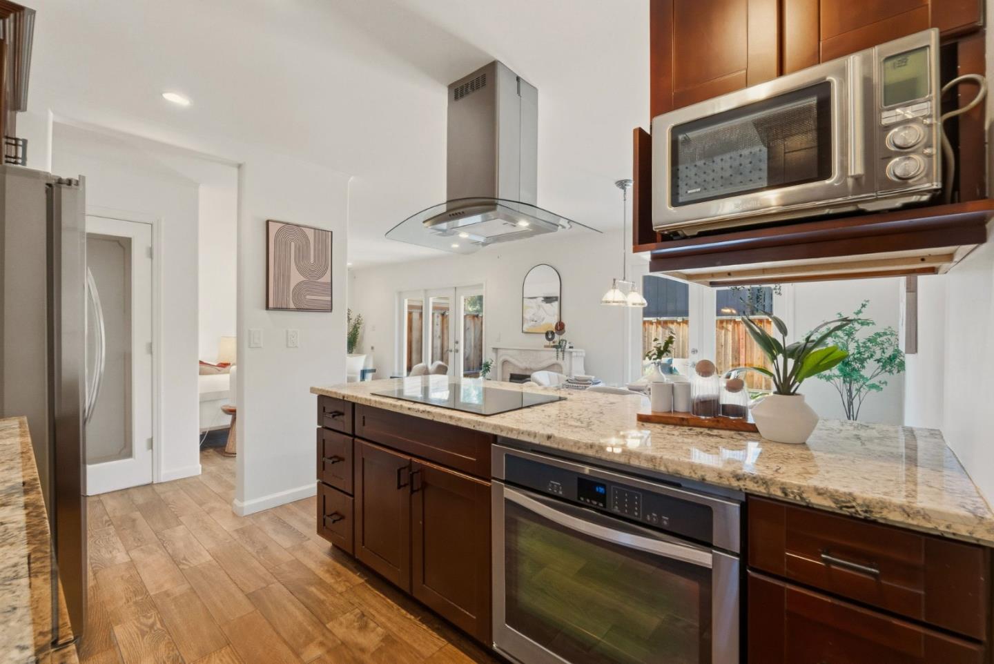 104 East Middlefield Road, Unit B Mountain View, CA 94043 - Photo 18 of 48 a kitchen with stainless steel appliances granite countertop a sink and stove top oven