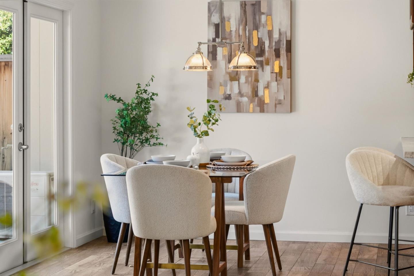 104 East Middlefield Road, Unit B Mountain View, CA 94043 - Photo 22 of 48 a view of a dining room with furniture and chandelier