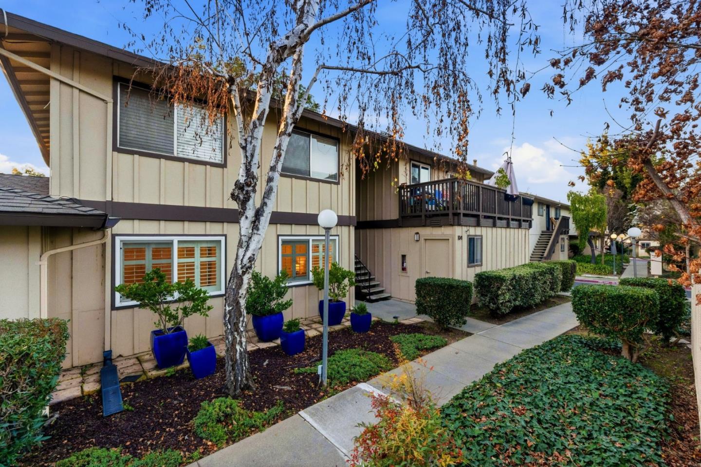 104 East Middlefield Road, Unit B Mountain View, CA 94043 - Photo 40 of 48 a front view of a house with garden