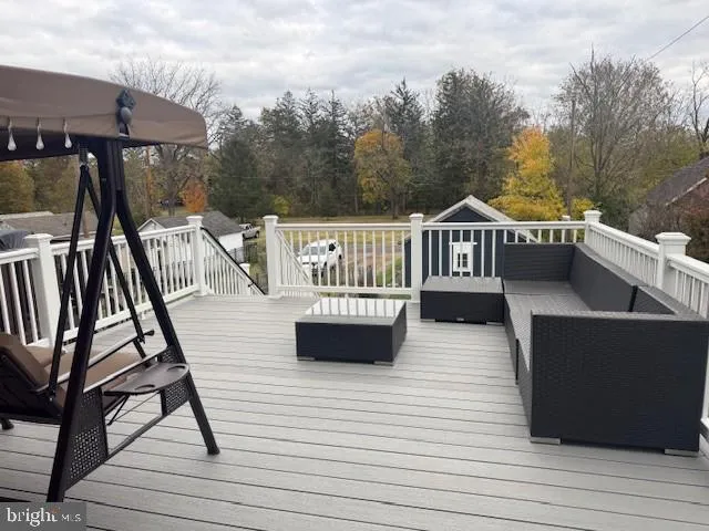a view of a roof deck with couches