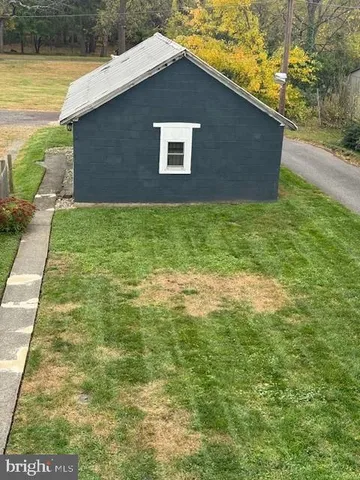 a brick house with a yard