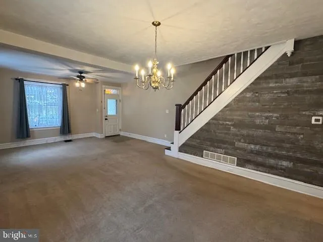 a view of a hallway with staircase
