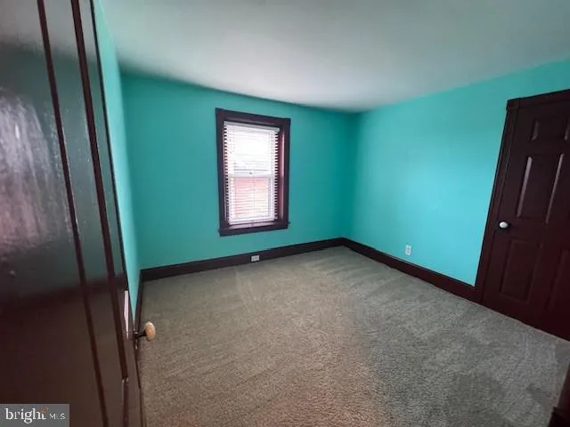 a view of a room that has a window in it