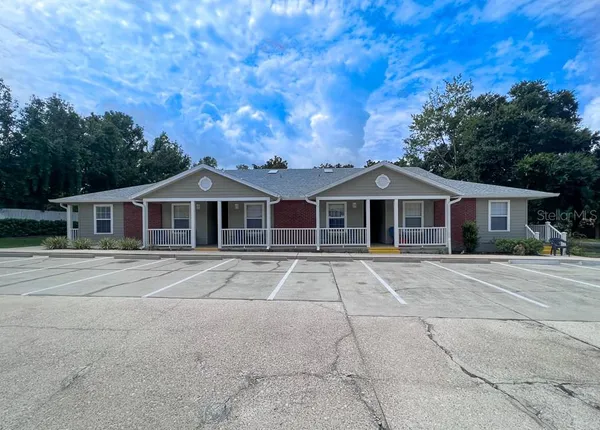 a front view of a house with yard