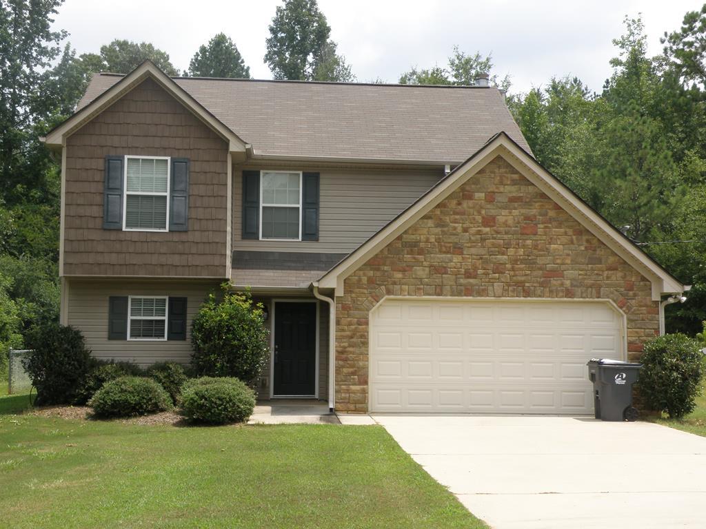 3375 Trotter''s Ridge Gray, GA 31032 - Photo 1 of 13 a view of a house with a yard and plants