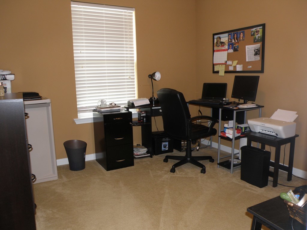 3375 Trotter''s Ridge Gray, GA 31032 - Photo 11 of 13 a view of a workspace with furniture and a window