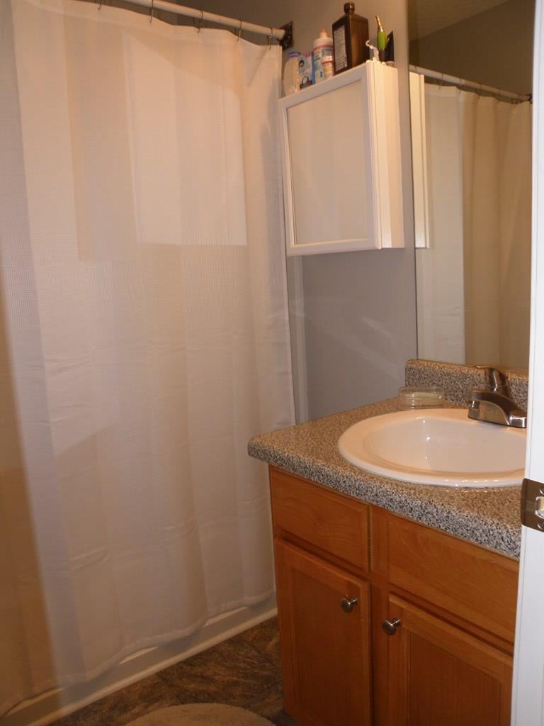 3375 Trotter''s Ridge Gray, GA 31032 - Photo 12 of 13 a bathroom with a granite countertop sink and a mirror