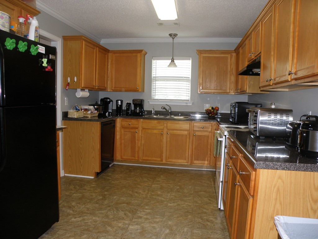 3375 Trotter''s Ridge Gray, GA 31032 - Photo 4 of 13 a kitchen with a sink a stove and cabinets