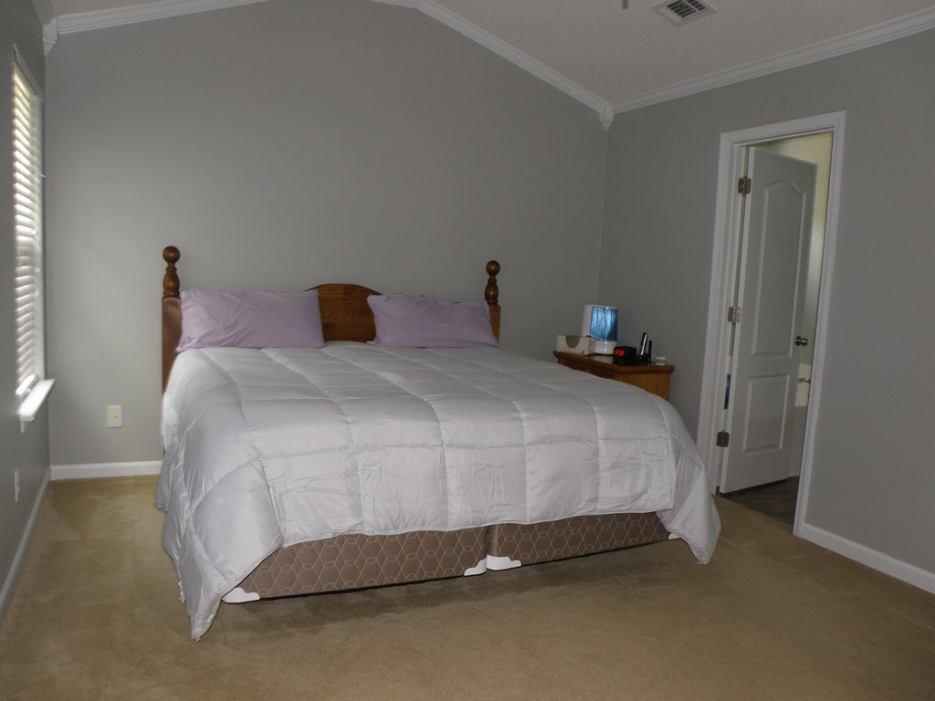 3375 Trotter''s Ridge Gray, GA 31032 - Photo 9 of 13 a bedroom with a bed and a table
