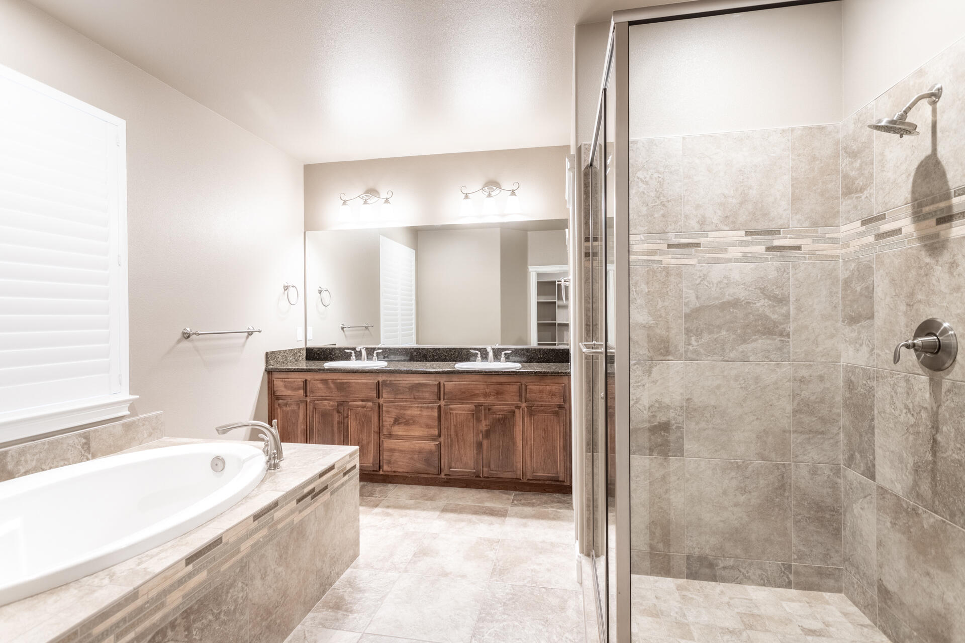 3241 Lemurian Road Redding, CA 96002 - Photo 15 of 34 a bathroom with a granite countertop tub a sink and a mirror