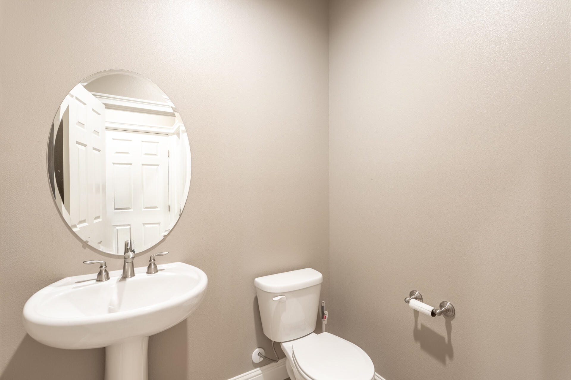 3241 Lemurian Road Redding, CA 96002 - Photo 25 of 34 a bathroom with a toilet sink and mirror