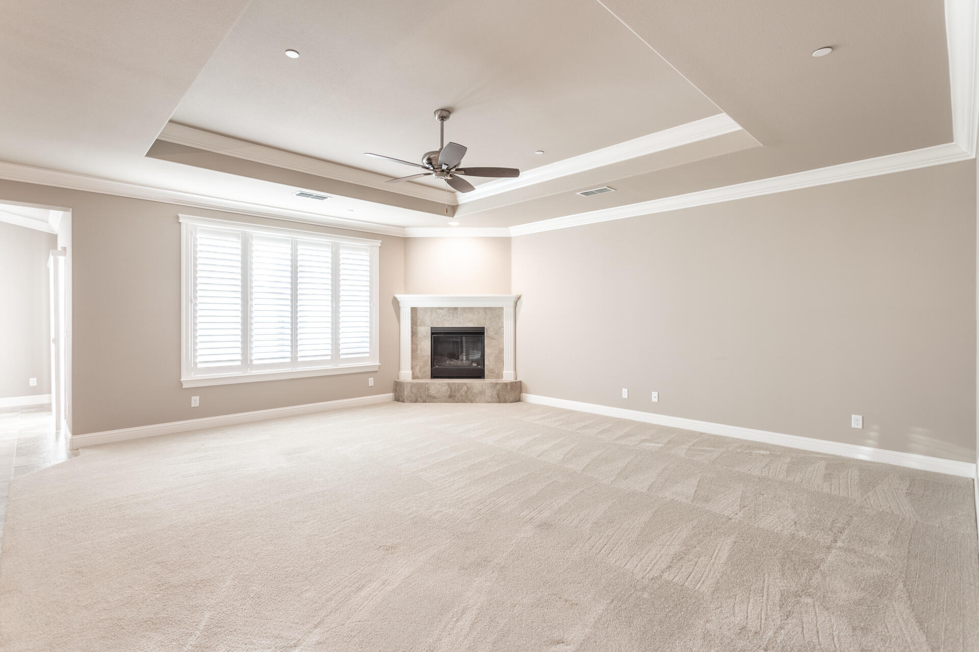 3241 Lemurian Road Redding, CA 96002 - Photo 6 of 34 an empty room with windows and ceiling fan