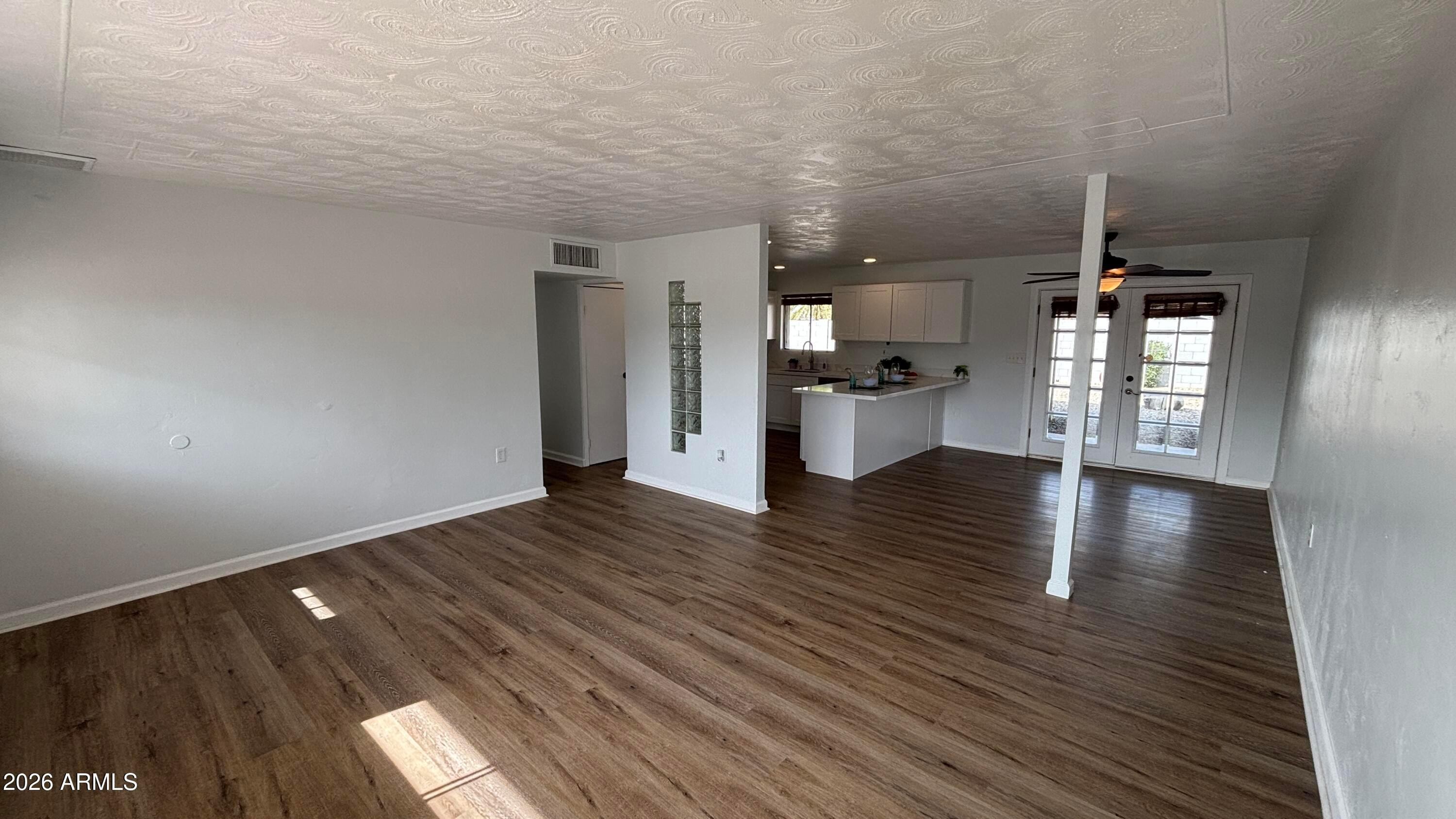 1000 West Elna Rae Street Tempe, AZ 85281 - Photo 4 of 22 a view of a living room with hardwood floor