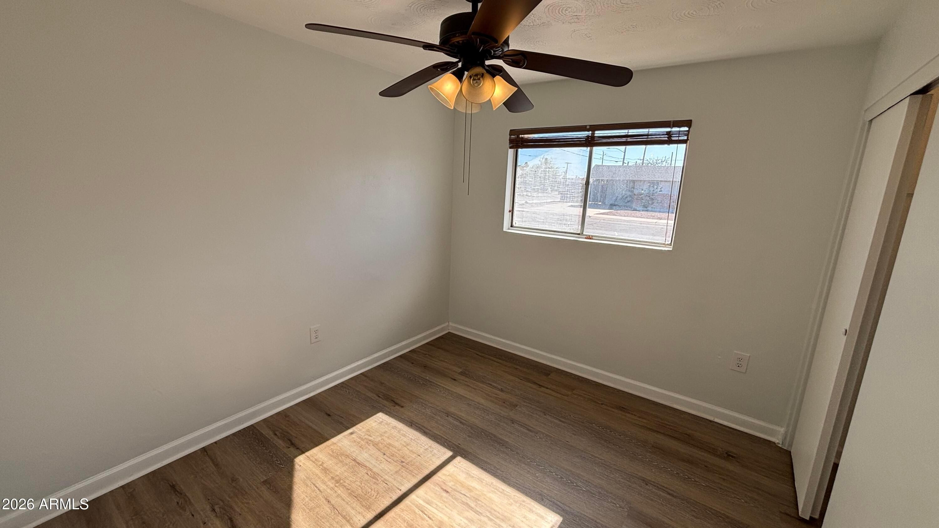 1000 West Elna Rae Street Tempe, AZ 85281 - Photo 9 of 22 a view of room with window and a ceiling fan
