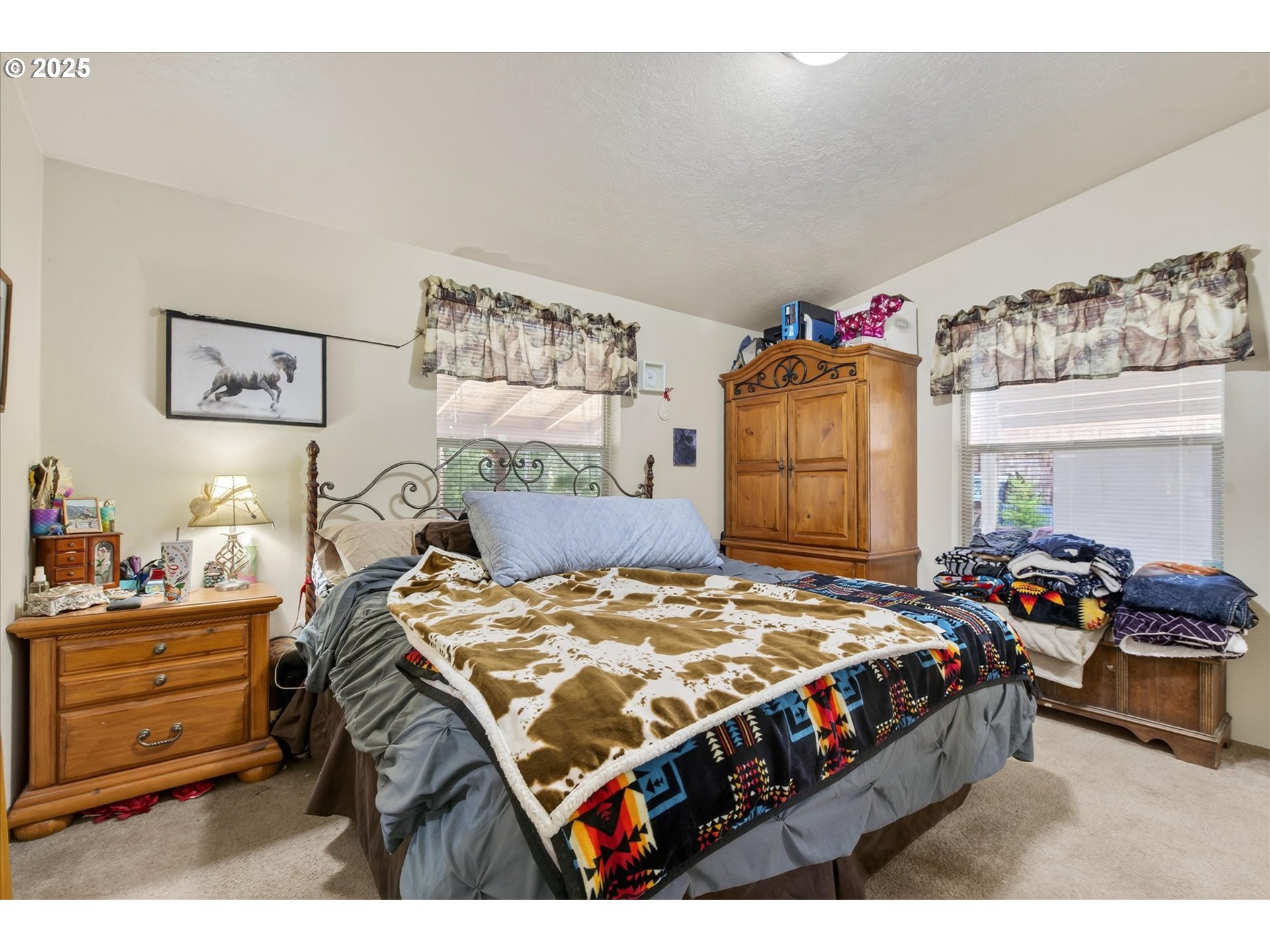 600 Northwest Cupid Avenue Sumpter, OR 97877 - Photo 12 of 29 a bedroom with a bed and dresser