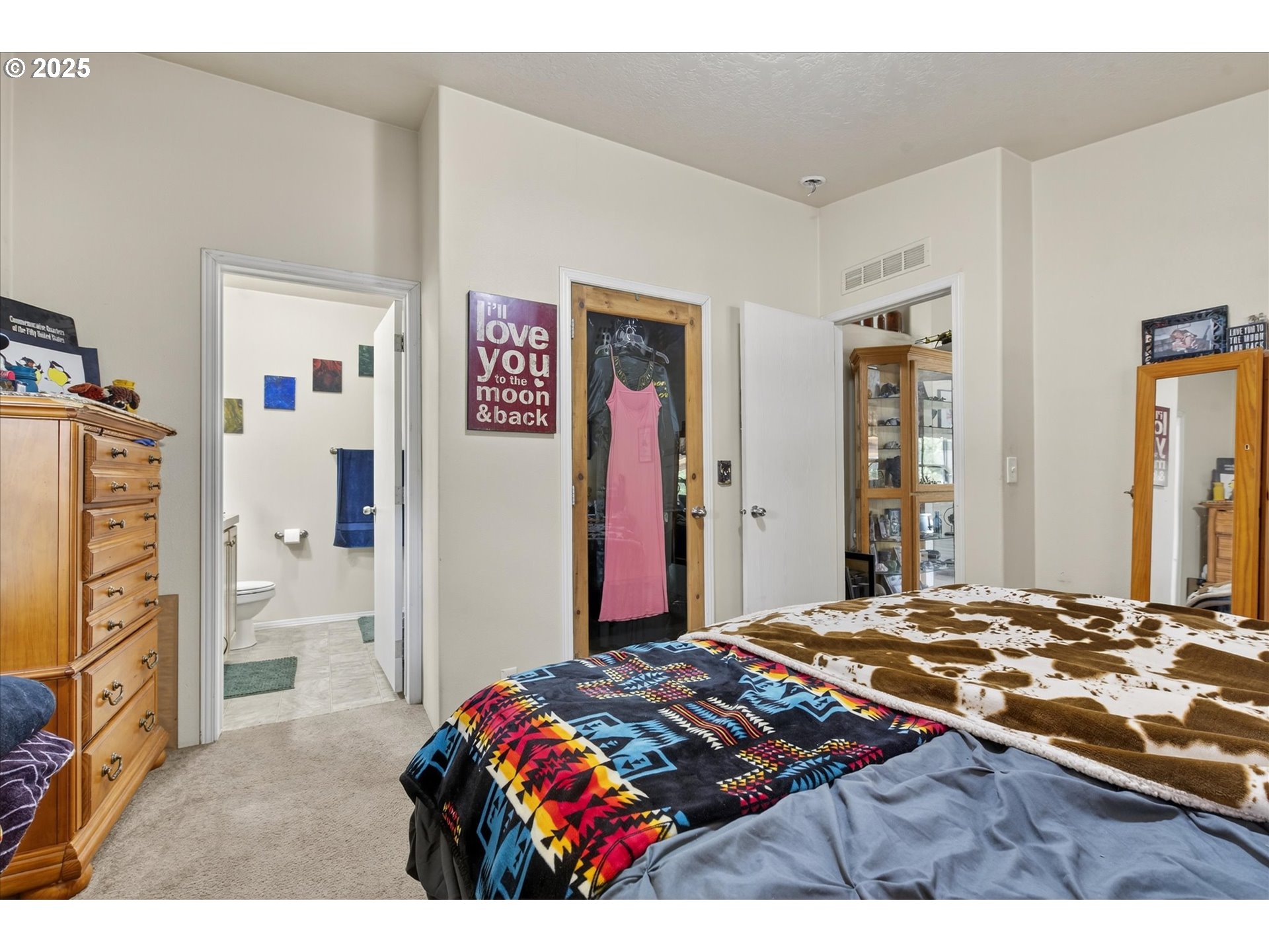 600 Northwest Cupid Avenue Sumpter, OR 97877 - Photo 13 of 29 a bedroom with a bed and a dresser
