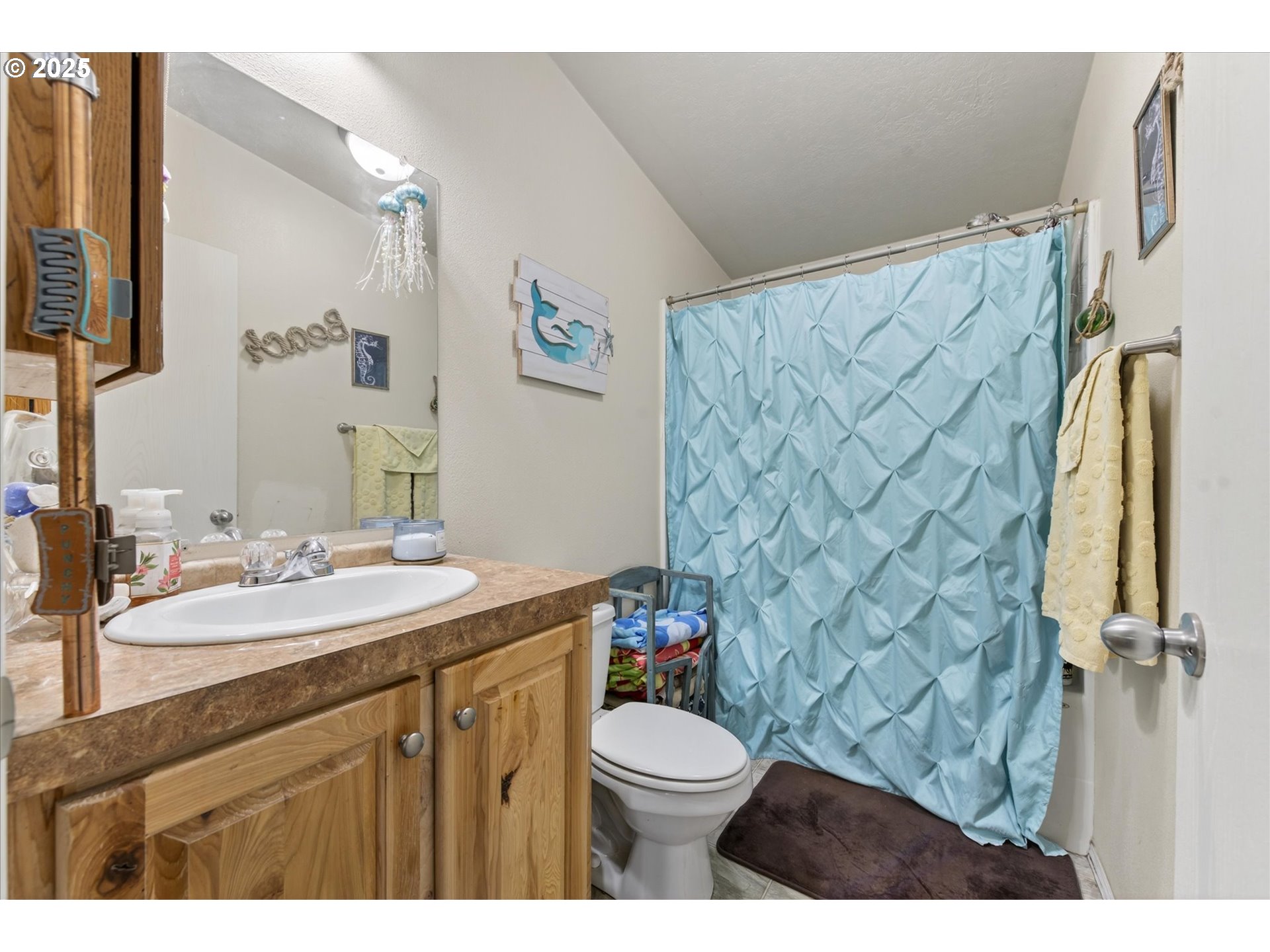 600 Northwest Cupid Avenue Sumpter, OR 97877 - Photo 17 of 29 a bathroom with a granite countertop toilet sink mirror and shower