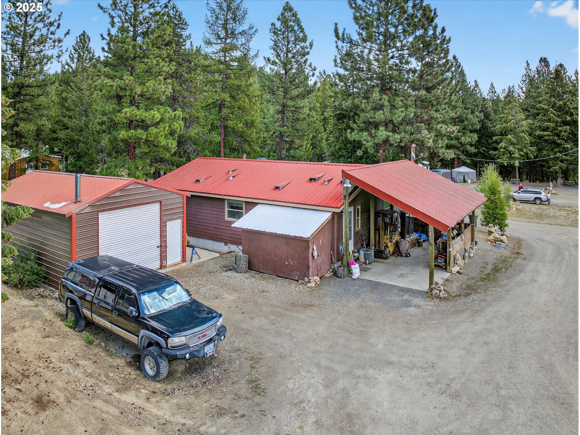 600 Northwest Cupid Avenue Sumpter, OR 97877 - Photo 21 of 29 an aerial view of a house with table and chairs