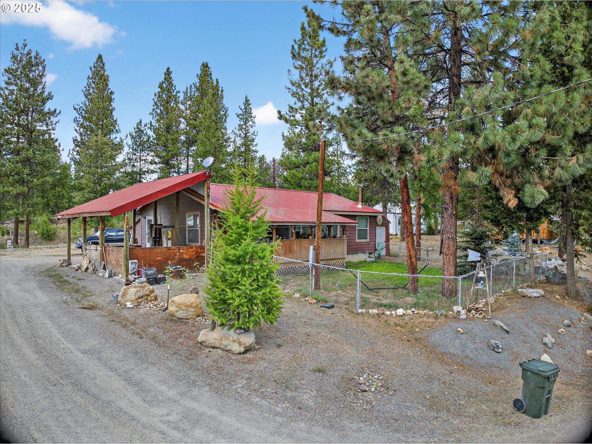 600 Northwest Cupid Avenue Sumpter, OR 97877 - Photo 26 of 29 a front view of a house with a yard
