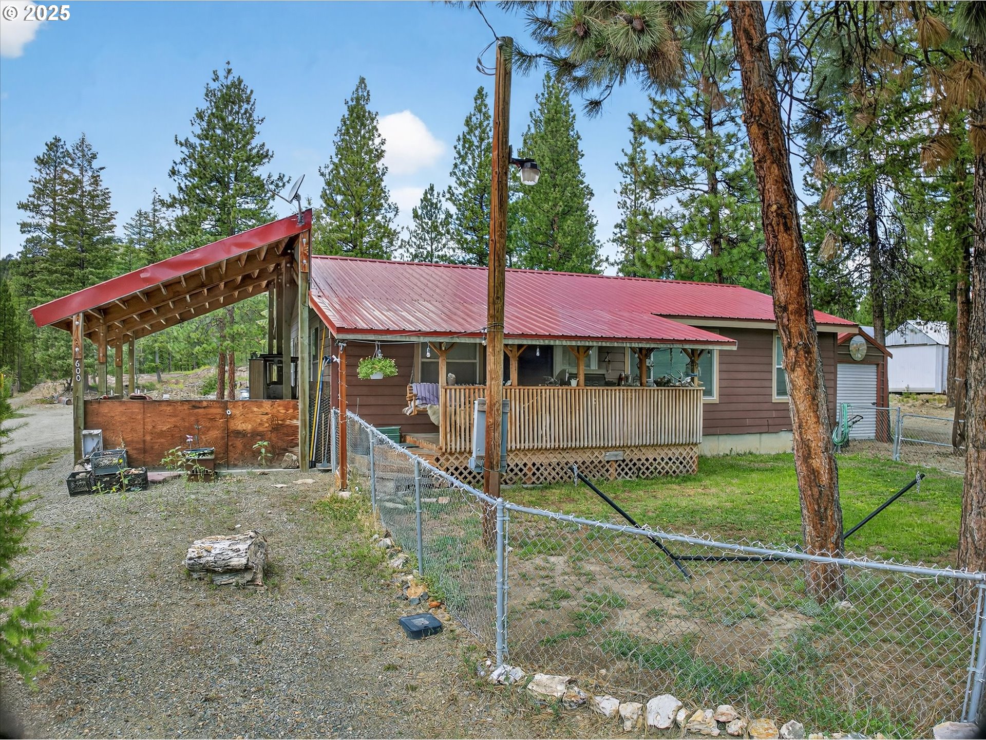 600 Northwest Cupid Avenue Sumpter, OR 97877 - Photo 27 of 29 a view of a house with a yard