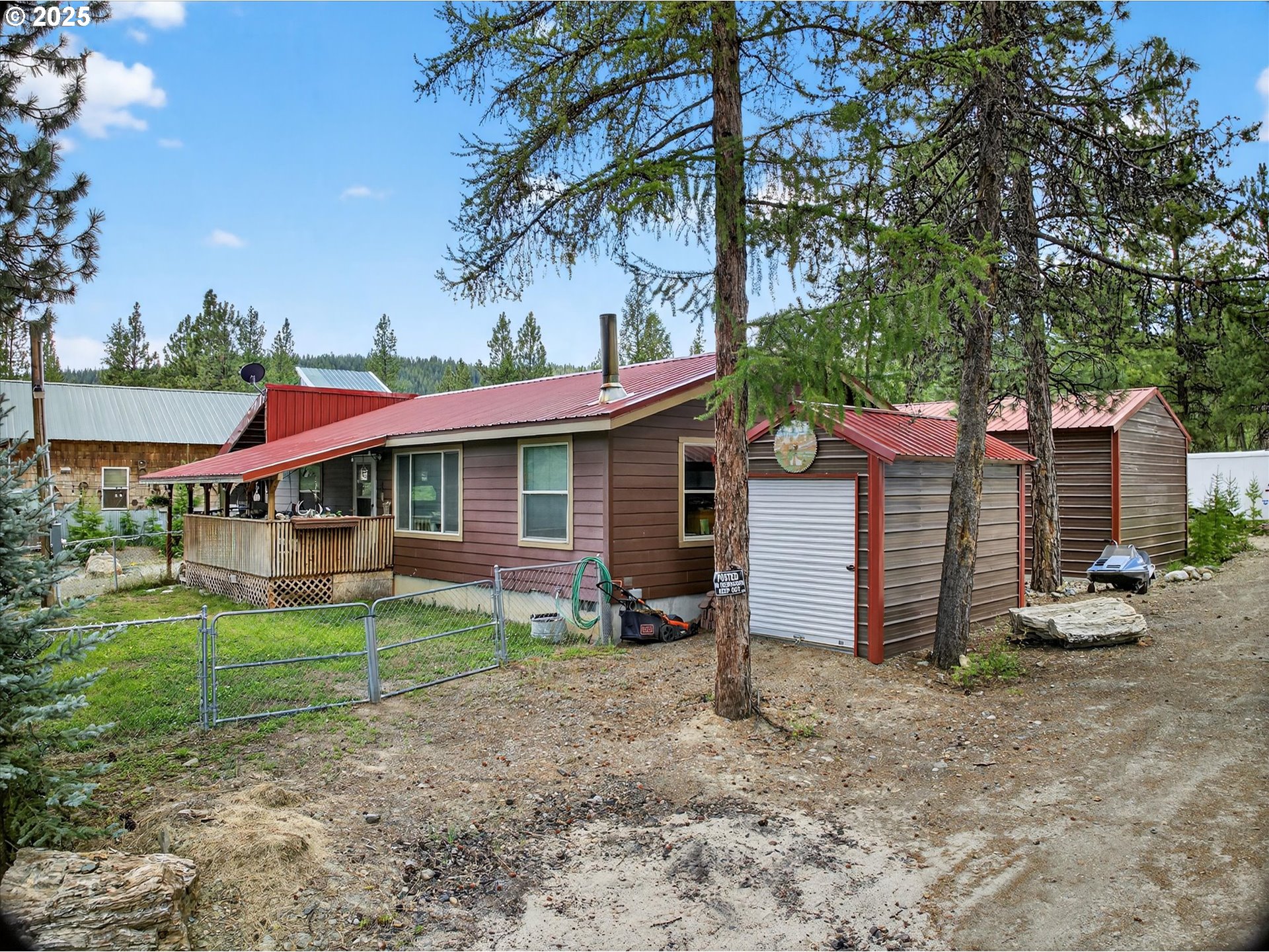 600 Northwest Cupid Avenue Sumpter, OR 97877 - Photo 28 of 29 a view of a house with a yard