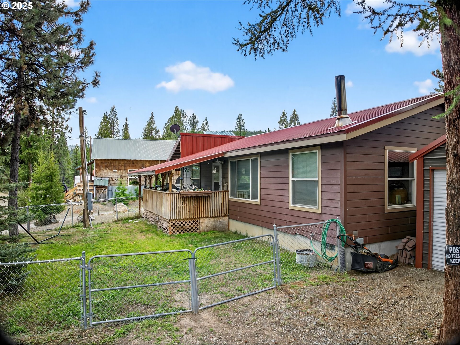600 Northwest Cupid Avenue Sumpter, OR 97877 - Photo 29 of 29 a view of a house with a yard