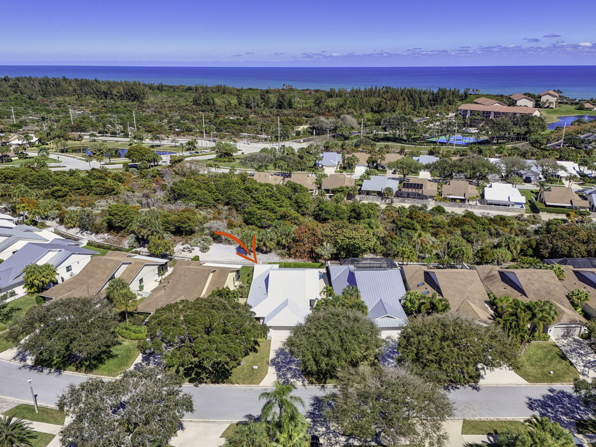 239 Ridge Road Jupiter, FL 33477 - Photo 62 of 75 an aerial view of residential houses with outdoor space and street view