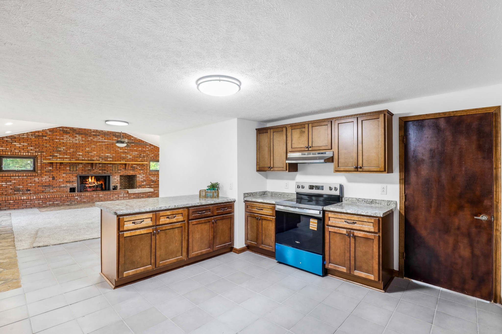 239 Wayne Threatt Road Dover, TN 37058 - Photo 22 of 41 a kitchen with stainless steel appliances granite countertop a stove and a sink
