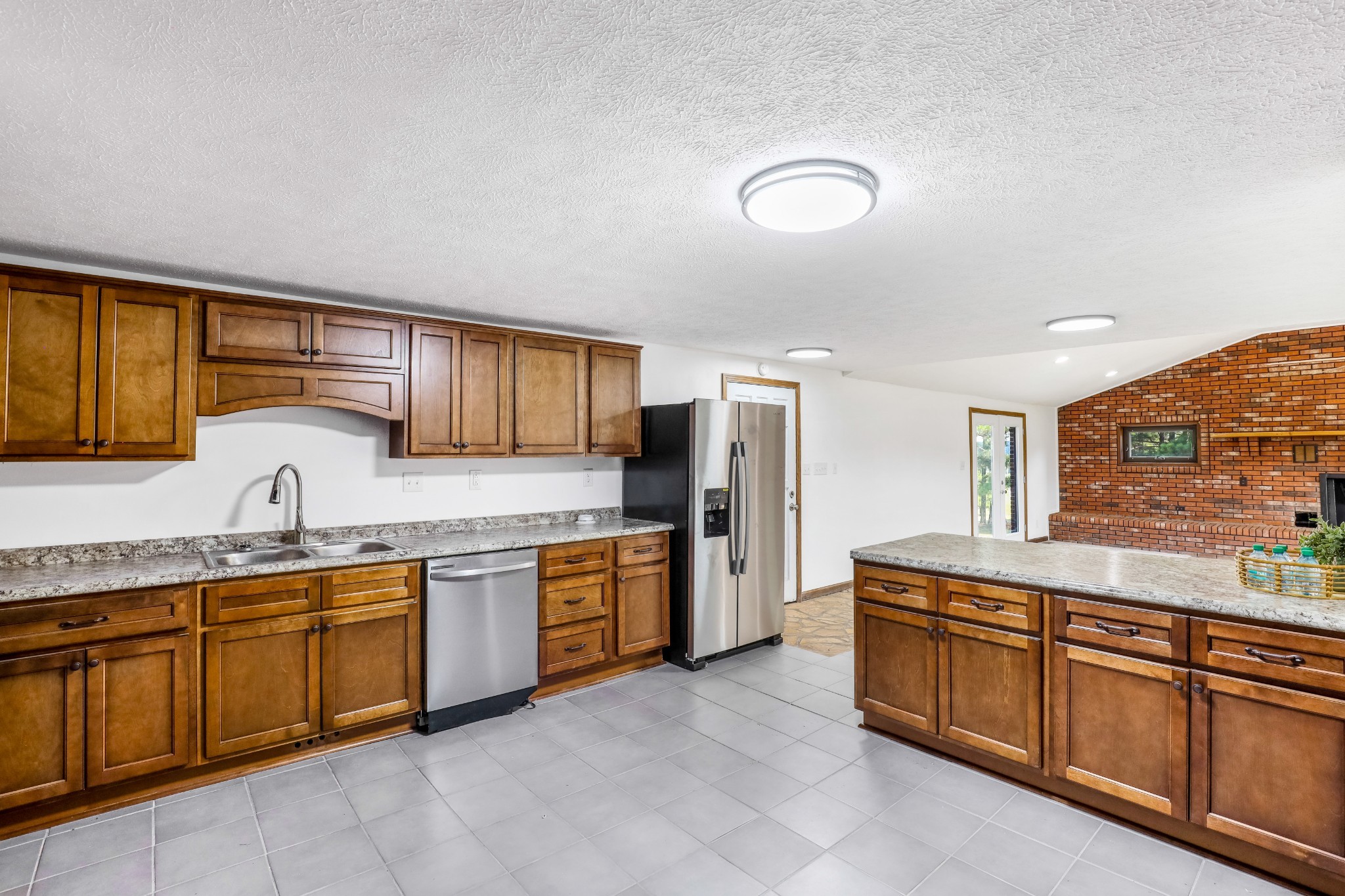 239 Wayne Threatt Road Dover, TN 37058 - Photo 23 of 41 a kitchen with stainless steel appliances granite countertop a sink and cabinets