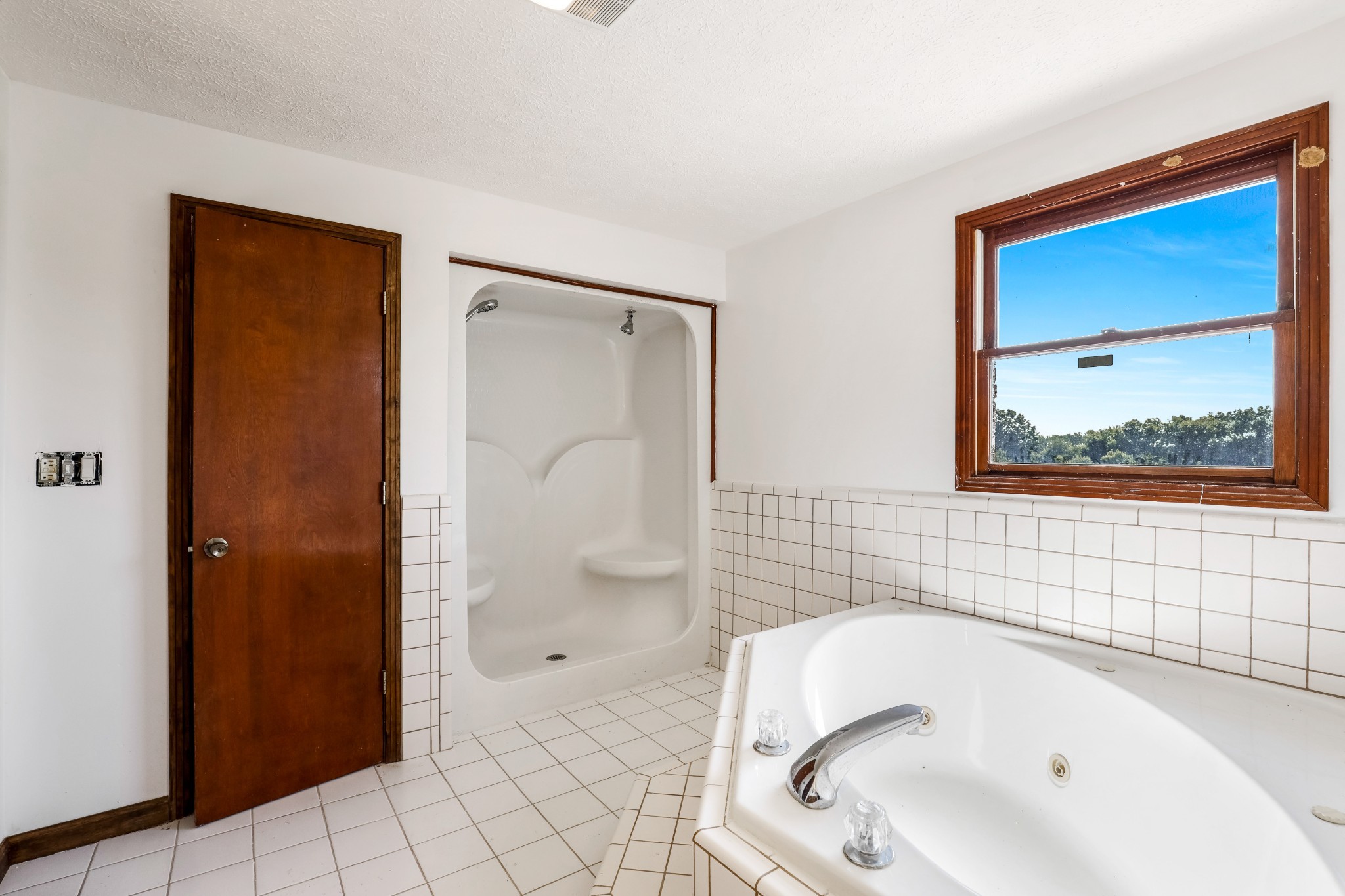 239 Wayne Threatt Road Dover, TN 37058 - Photo 36 of 41 a bathroom with a sink a mirror and a shower