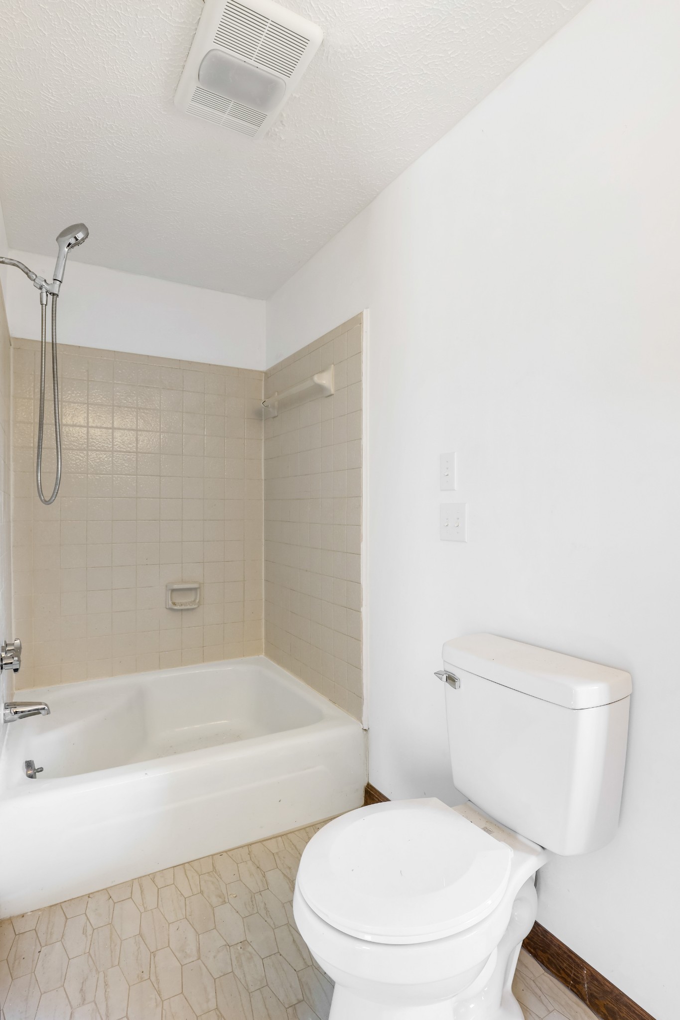 239 Wayne Threatt Road Dover, TN 37058 - Photo 39 of 41 a white toilet sitting next to a bath tub