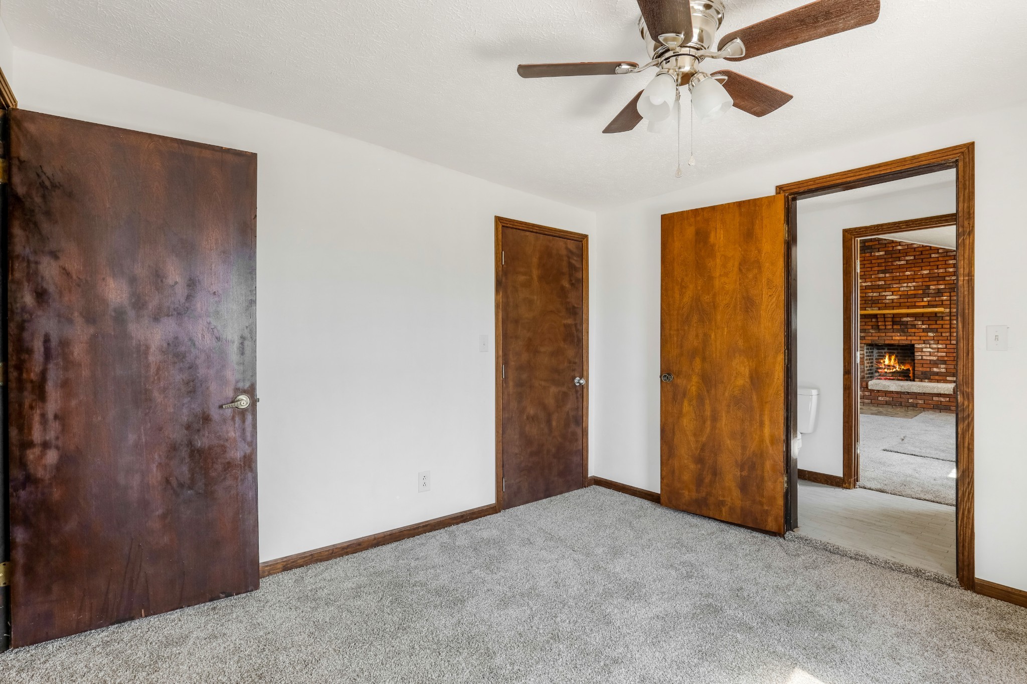 239 Wayne Threatt Road Dover, TN 37058 - Photo 40 of 41 a view of a room with closet and a chandelier fan