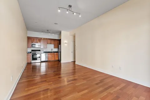 a view of kitchen with wooden floor and window