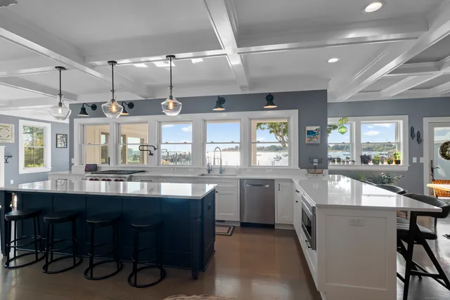 a large kitchen with a table and chairs