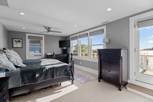 a bedroom with a bed and a couch