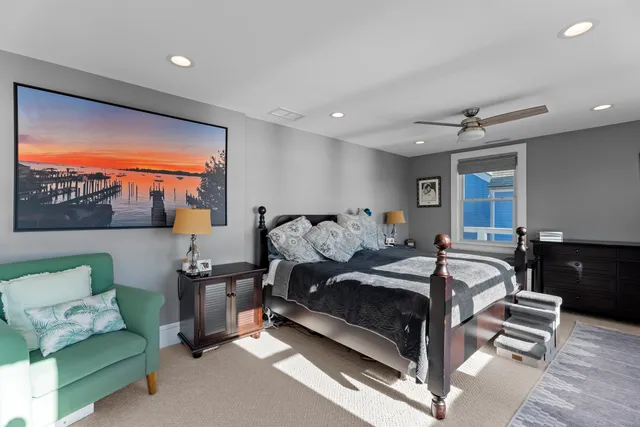 a spacious bathroom with double vanity and a mirror