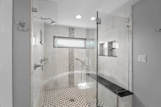 a view of a balcony with wooden floor and fence