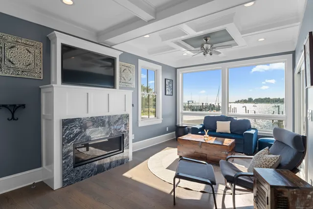 a living room with furniture fireplace and a flat screen tv