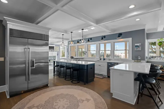 a kitchen with cabinets and refrigerator